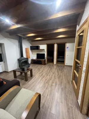 a living room with a couch and a tv at Villa Adilia in Padornelo