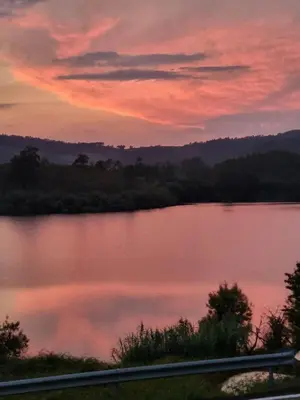 a view of a lake at sunset at Casa Justa in Castrelo de Miño