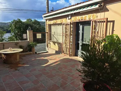a porch of a house with a patio at Casa Justa in Castrelo de Miño