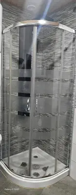 a shower with a glass door in a room at Casa Justa in Castrelo de Miño