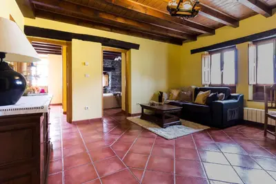 a living room with a couch and a table at Casa Gayón in Pola de Allande
