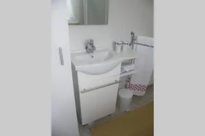 a bathroom with a sink and a mirror at CASA MARGARITAS in Ourense