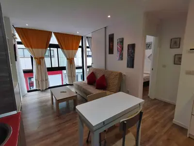 a living room with a couch and a table at Apartamento Carreira Sada in Sada