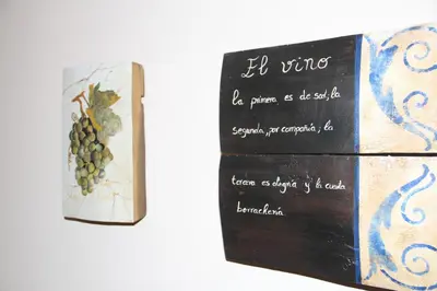 a book with a picture of a bunch of grapes at Casa Rural La Torre De Babel in Molinaseca