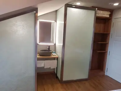 a bathroom with a sink and a mirror at Apartamentos Turísticos y Habitaciones Cidade Vella by Bossh! Hotels in Ourense