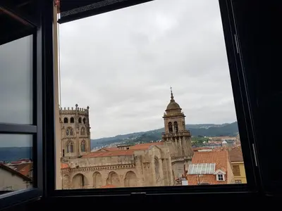 a view of a cathedral from a window at Apartamentos Turísticos y Habitaciones Cidade Vella by Bossh! Hotels in Ourense