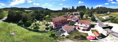 an aerial view of a large house with a yard at Casa de Padrón in Padrón