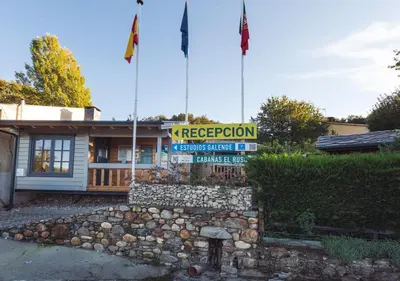 a building with two flags on top of it at Estudios Galende in Galende