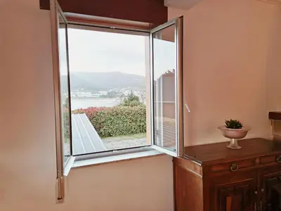 a window in a room with a view at Casa Courcelles - Viveiro in Viveiro