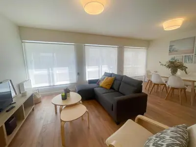 a living room with a couch and a table at Housingcoruña sada playa in Sada