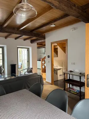 a living room with a couch and a table at Casa Alameda 33 de Casas Das Figueiras en Ría Eo-Ribadeo in Castropol