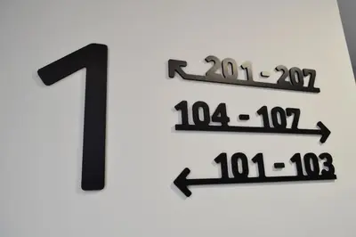a number one sign on a wall at Alda Catedral in Santiago de Compostela