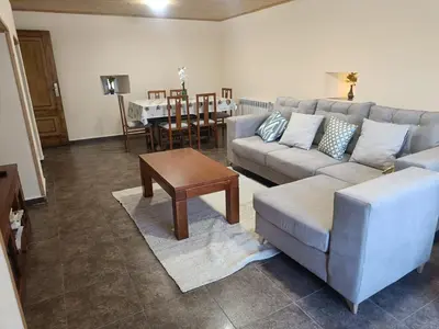 a living room with a couch and a table at CASA ISAURA DE PENA Camino Primitivo in Pacio
