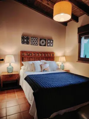 a blue couch sitting in a living room at Finca O Loureiro in Amés