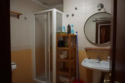 a bathroom with a shower and a sink at Apartamento Faro de Tapia in Tapia de Casariego