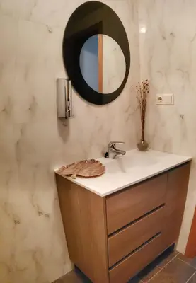 a bathroom with a sink and a mirror on the wall at Santiago Sur, Camino Portugués in Milladoiro