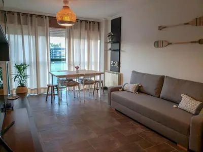 a living room with a couch and a table at Santiago Sur, Camino Portugués in Milladoiro
