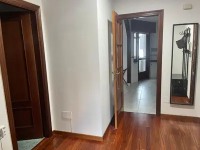 an empty room with a door and a hallway at Apartamento Bralo in Padrón