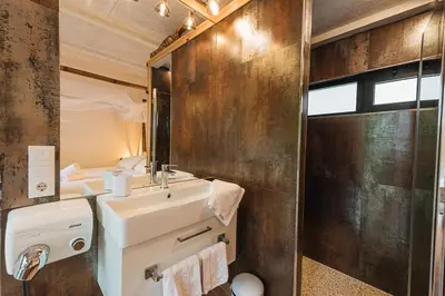a bathroom with a sink and a mirror at Maxia Galega -Arte, Natureza, Relax -Ribeira Sacra in Monforte de Lemos