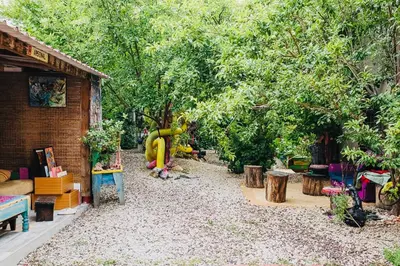 a garden with a playground with a large elephant statue at Maxia Galega -Arte, Natureza, Relax -Ribeira Sacra in Monforte de Lemos