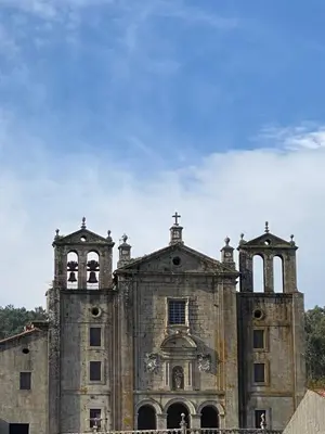 an old church with two towers on top of it at Apartamento Padron Centro P8 by URent in Padrón