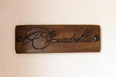 a sign on a wall with the word gibraltar at Apartamentos Rurales Casa Llongo in Coaña