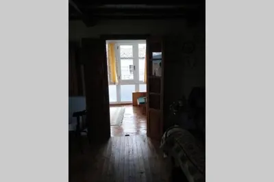 a hallway with a door open to a living room at Casa Ribeira Sacra, Ourense, Niñodaguia, Galicia in Ourense