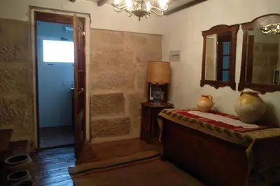 a room with a bed and a mirror and a door at Casa Ribeira Sacra, Ourense, Niñodaguia, Galicia in Ourense