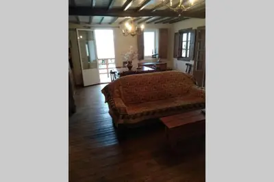 a living room with a couch and a table at Casa Ribeira Sacra, Ourense, Niñodaguia, Galicia in Ourense