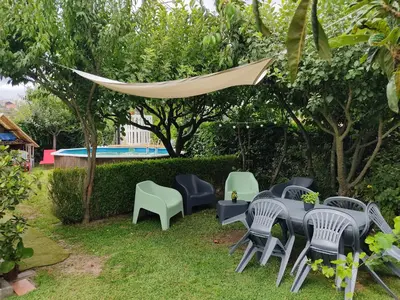 a group of chairs and tables in a yard at A Chabola Mondariz in Pontevedra