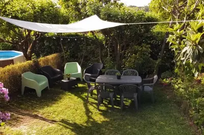 a group of chairs and a table in a yard at A Chabola Mondariz in Pontevedra