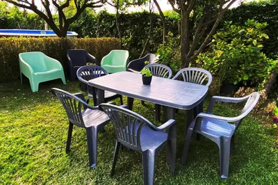a table and chairs sitting in the grass at A Chabola Mondariz in Pontevedra