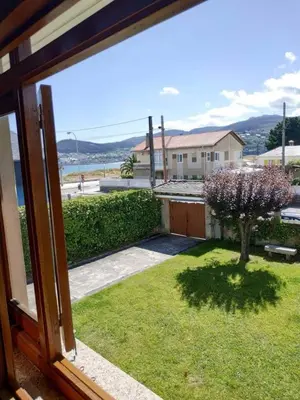 a view of a yard from a window of a house at Covas Beach Arena in Viveiro