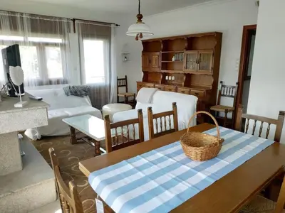 a living room with a table with a basket on it at Covas Beach Arena in Viveiro