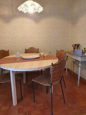 a dining room with a table and chairs at Casa 2 Gallos in Ourense