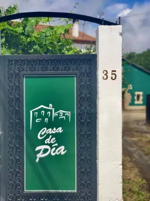 a sign for a pizza restaurant on a street at A Casa de Pia in Sober