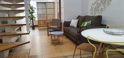 a living room with a couch and a table at Apartamentos Antares 3 in Milladoiro