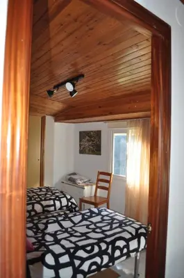 a room with a light hanging on the wall at Ollar do Cido in Seoane