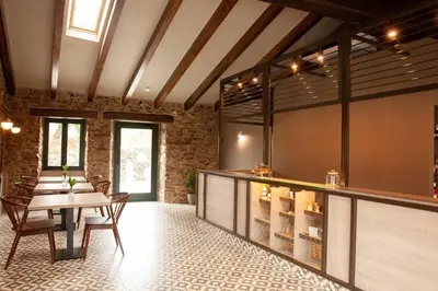 a dining room with a table and chairs at Casa Rico de Medín in O Pino