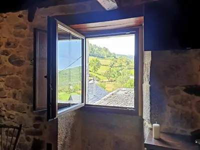 a window in a kitchen with a view at El Cuarto in Suarbol