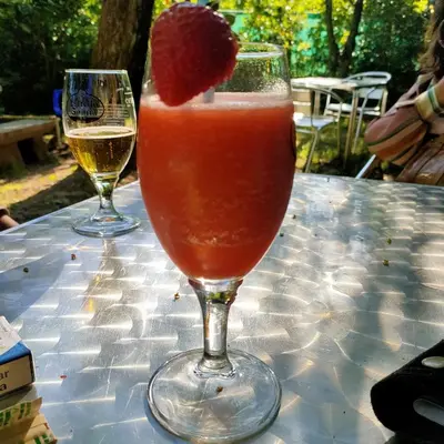 a drink in a wine glass with a strawberry in it at Eirixo in Valga