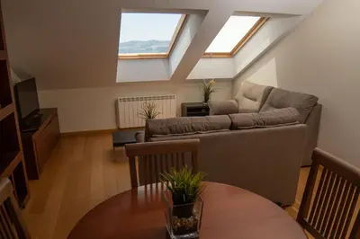 a living room with a couch and a table at Figueras 5 in figueras