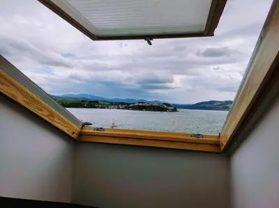a window in a room with a view of the water at Figueras 5 in figueras