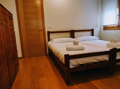 a bedroom with a bed with two towels on it at Figueras 5 in figueras