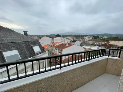 a balcony with a view of a city at Altamira in Caldas de Reis