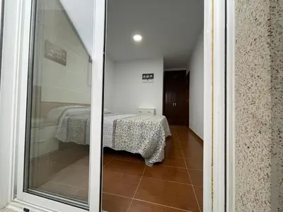 a view of a room with a table in a room at Altamira in Caldas de Reis