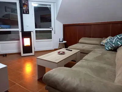 a living room with a couch and a coffee table at Altamira in Caldas de Reis