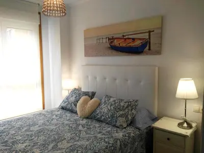 a bedroom with a bed with a boat on it at San Ciprian Marinero by I Love Norte in San Ciprián