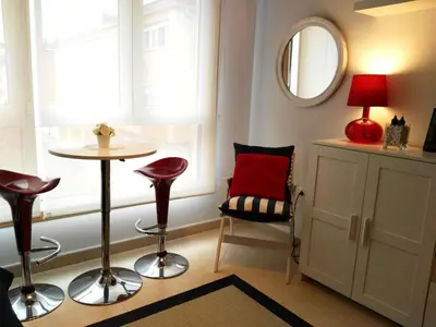 a room with a table and chairs and a mirror at San Ciprian Marinero by I Love Norte in San Ciprián