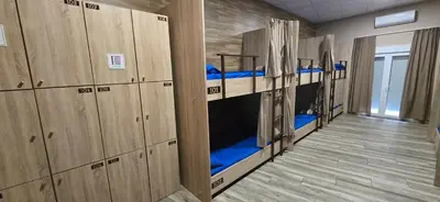 a row of bunk beds in a dorm room at ALBERGUE A QUEIMADA Exclusivo Peregrinos in Caldas de Reis